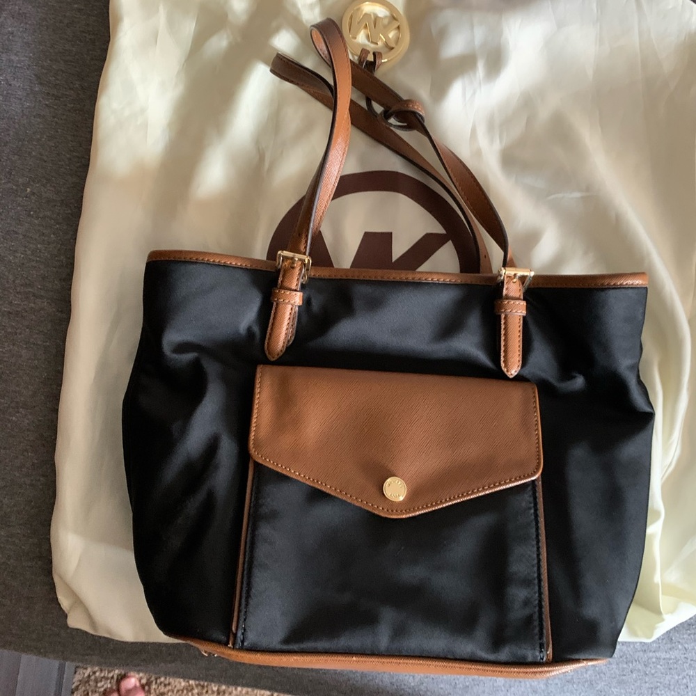 Black and brown Michael Kors bag with dust bag